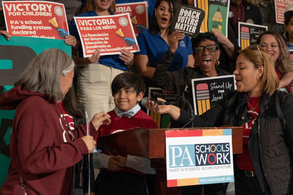 A child speaks at a rally