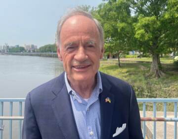 Four-term incumbent U.S. Sen. Tom Carper announced he was not seeking re-election in 2024 during a speech at the redeveloped Wilmington Riverfront that his gubernatorial administration helped create in the 1990s. (Cris Barrish/WHYY)