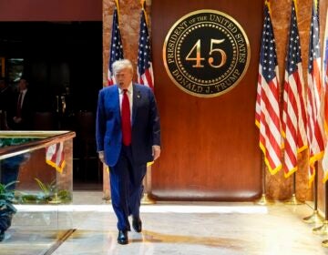 Trump walking inside Trump Tower