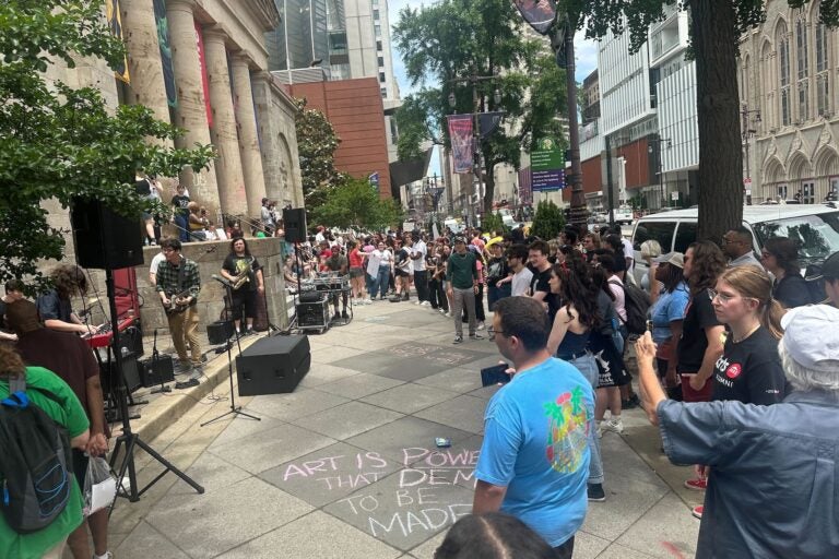 About 100 students, faculty and alumni gathered in front of the University of the Arts campus