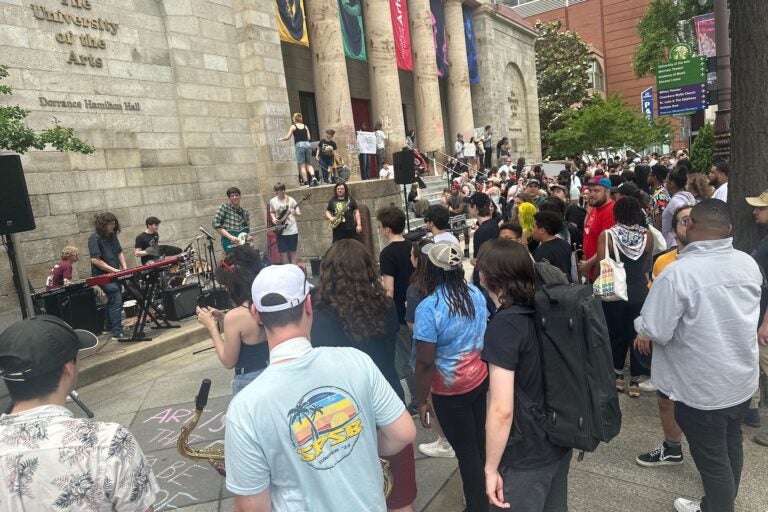 About 100 students, faculty and alumni gathered in front of the University of the Arts campus