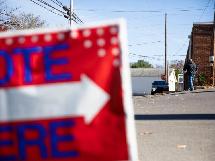 VOTE HERE sign at a polling place