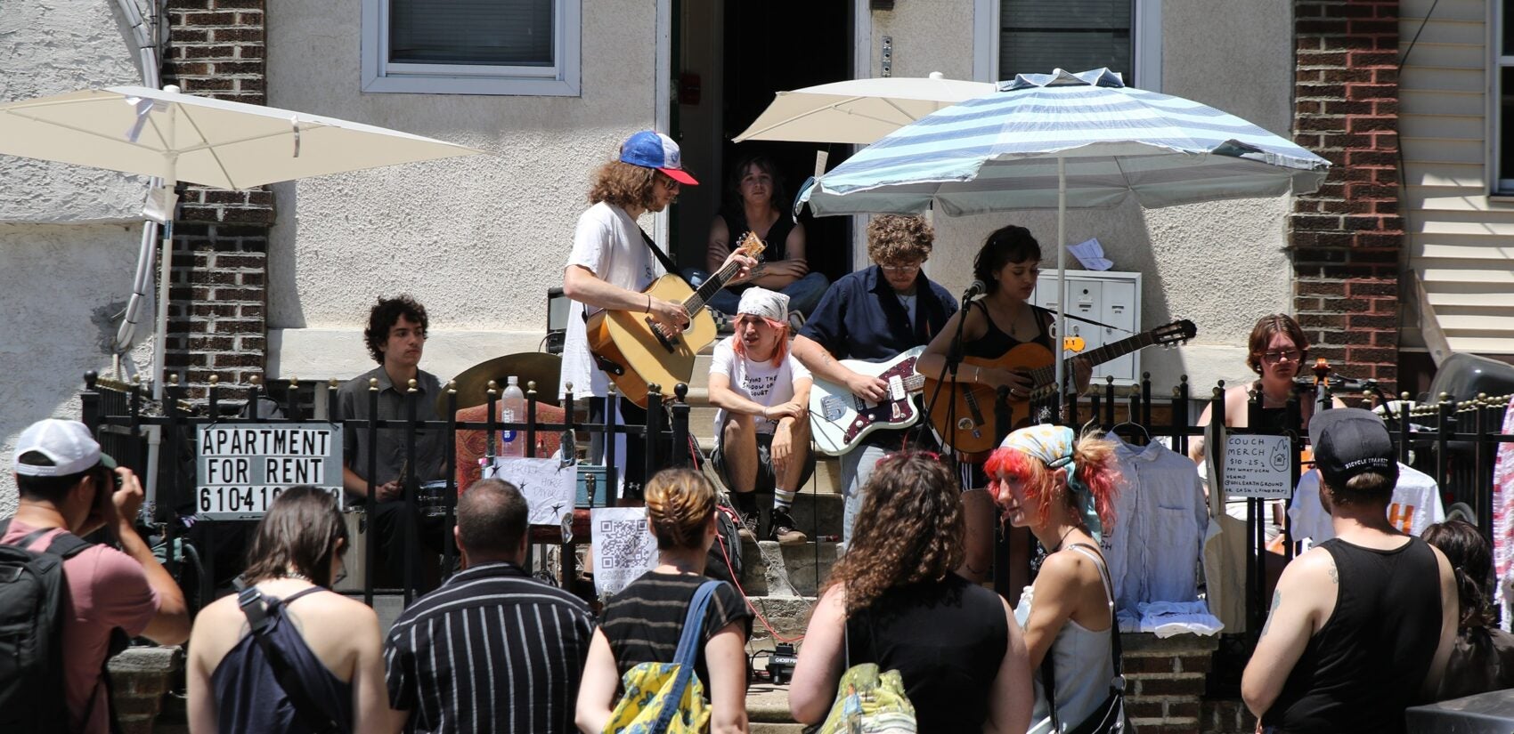 Porchfest attendees watch a band