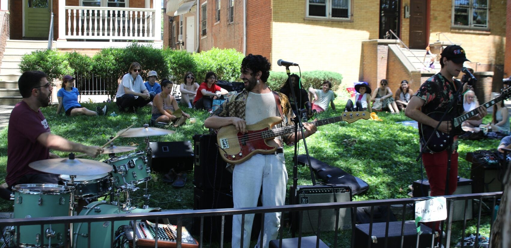 a band plays in a yard