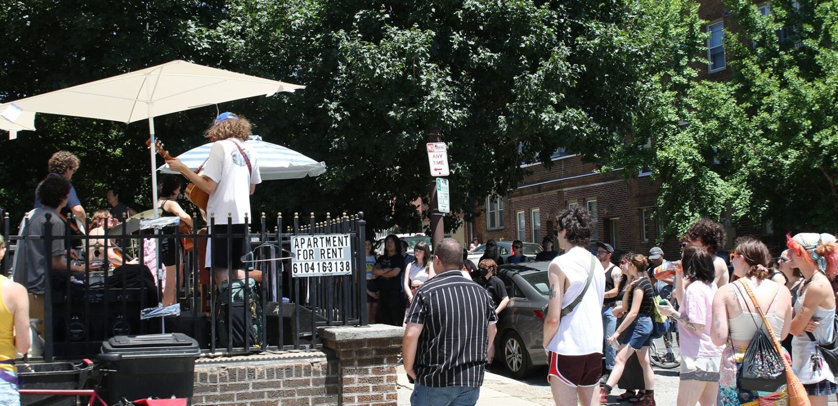 Porchfest attendees watch a band