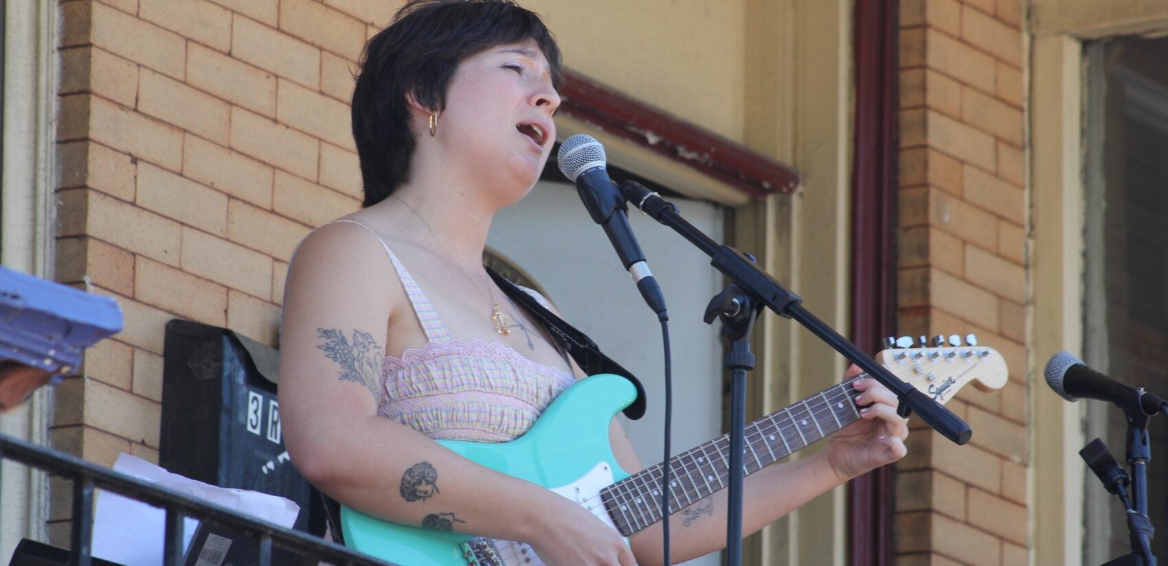 Merritt playing guitar and singing