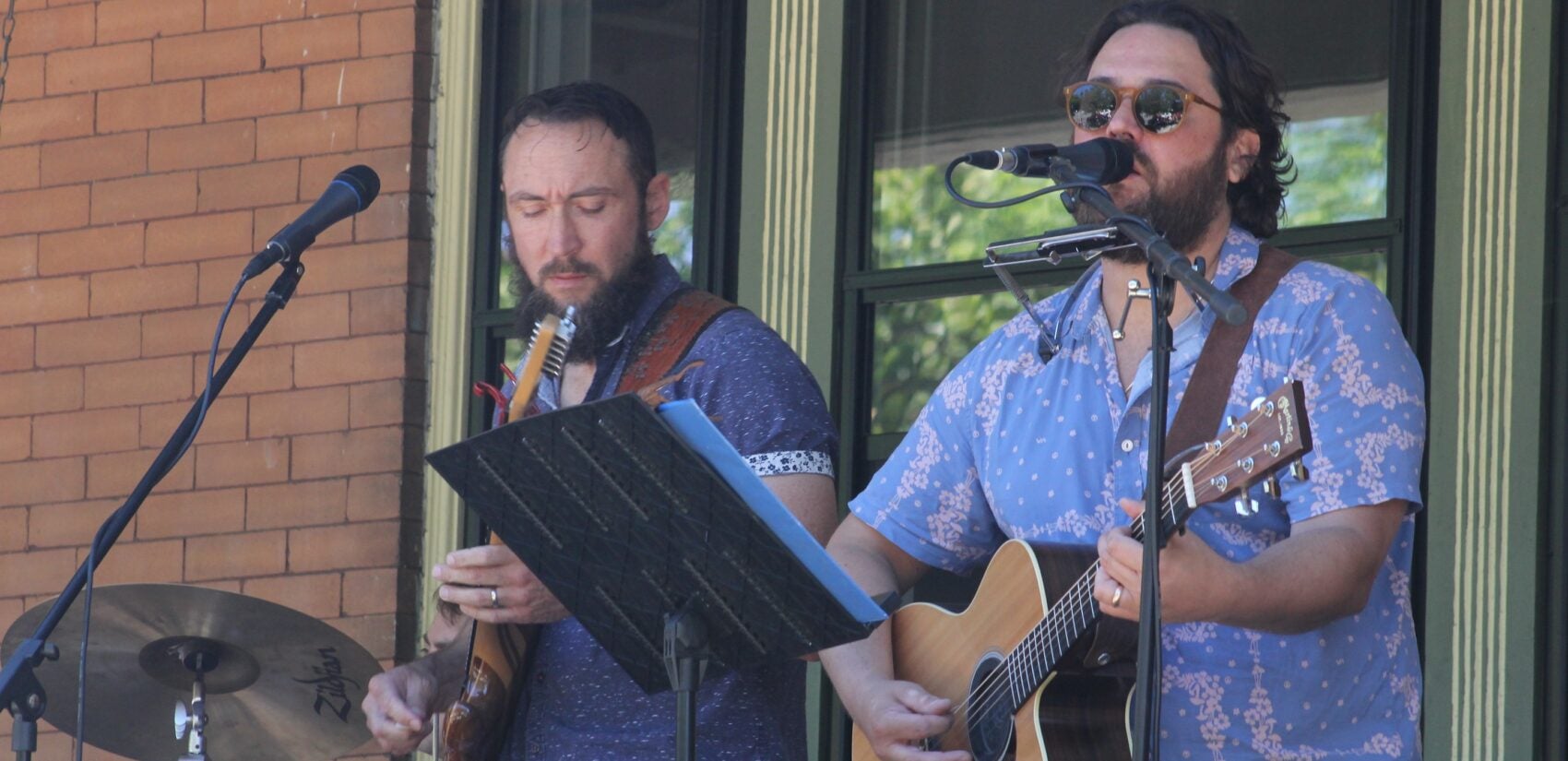 a band plays two guitars and sings