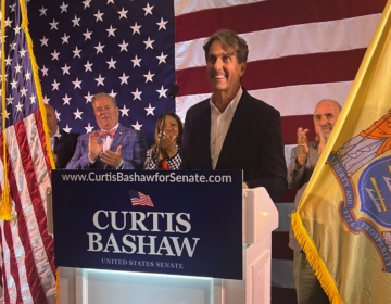 Curtis Bashaw speaking at a podium