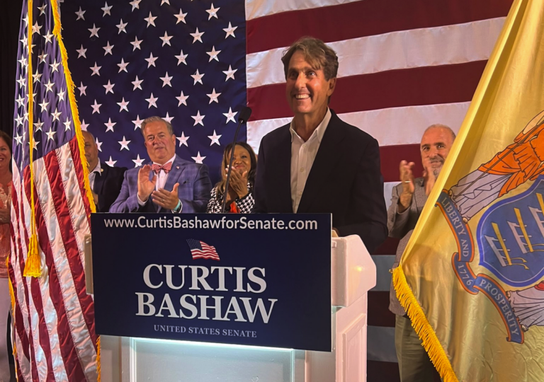 Curtis Bashaw speaking at a podium