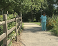 a woman on a flowery path