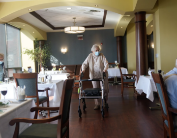 May Nast arrives for dinner at RiverWalk, an independent senior housing facility, in New York, April 1, 2021. (Seth Wenig/AP)